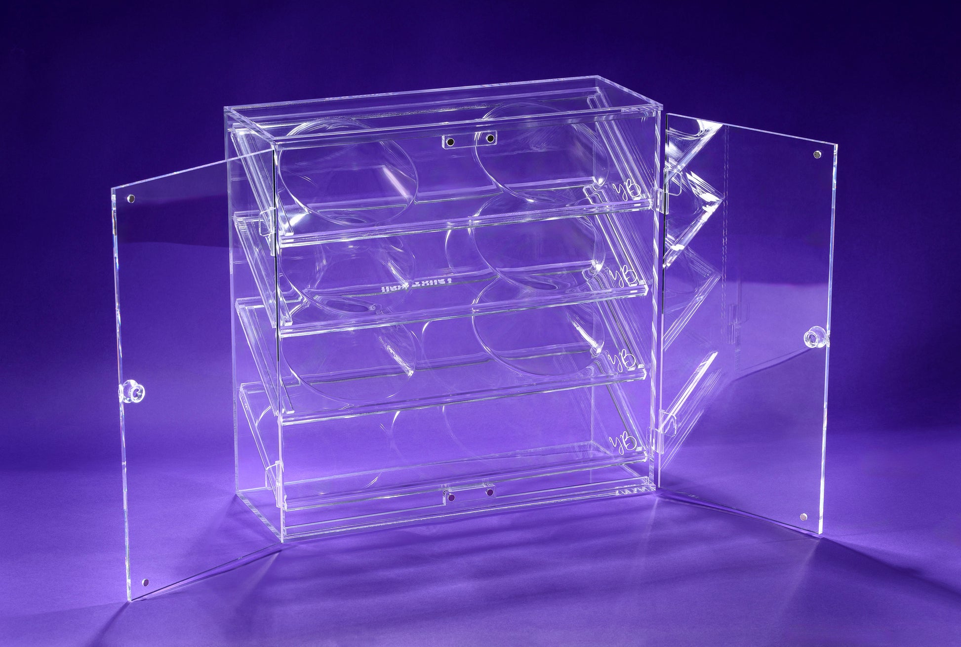 Clear acrylic display Bra case on a purple background